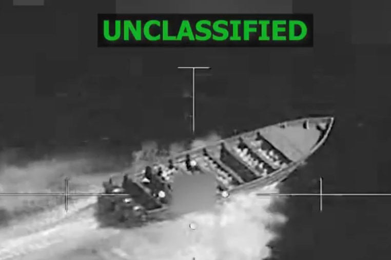 A black and white video still of a target on a boat