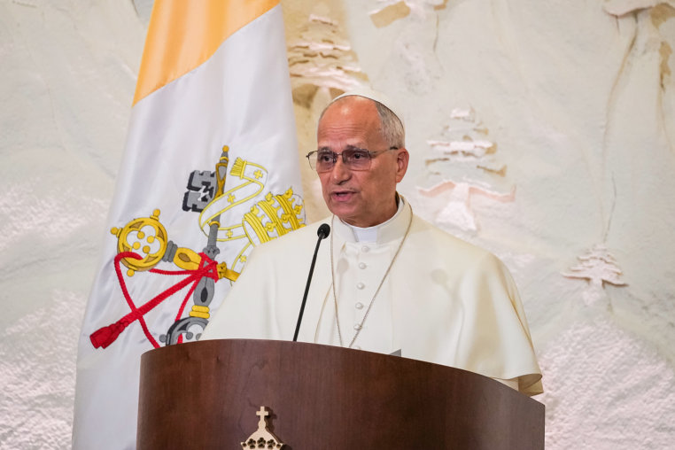 Pope Leo XIV speaks at a podoium