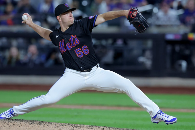Sep 12, 2025; New York City, New York, USA; New York Mets relief pitcher Ryan Helsley (56) pitches against the Texas Rangers during the ninth inning at Citi Field. Mandatory Credit: Brad Penner-Imagn Images
