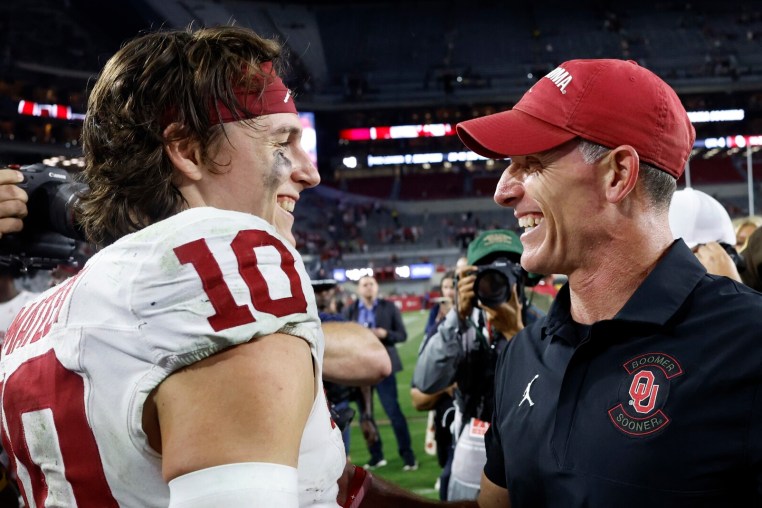 TUSCALOOSA, ALABAMA - NOVEMBER 15: John Mateer #10 of the Oklahoma Sooners celebrates with Brent Venables of the Oklahoma Sooners after a win over the Alabama Crimson Tide in a football game at Bryant Denny Stadium on November 15, 2025 in Tuscaloosa, Alabama. (Photo by Butch Dill/Getty Images)