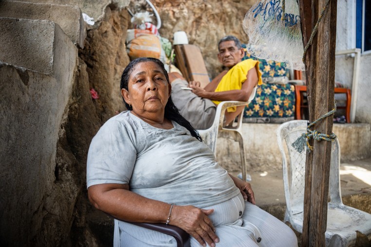 Carmela Medina and Alejandro Carranza, parents of Alejandro Carranza, a Colombian man who allegedly died when the U.S. bombed a boat supposedly carrying drugs in the Caribbean, pose for a photo at their house in Santa Marta on October 21, 2025.