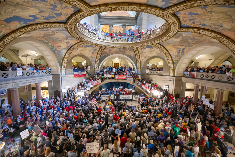 People gather at the Missouri statehouse in Jefferson City to protest redistricting