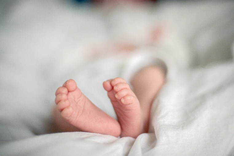 Feet of a newborn baby.