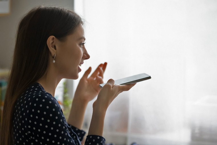 Woman speaking into phone