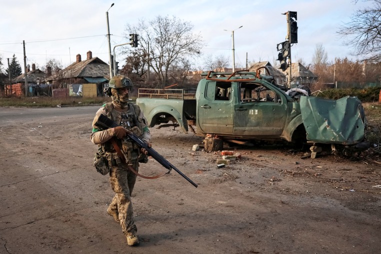 Ukrainian serviceman walks on a street in the frontline town of Kostiantynivka