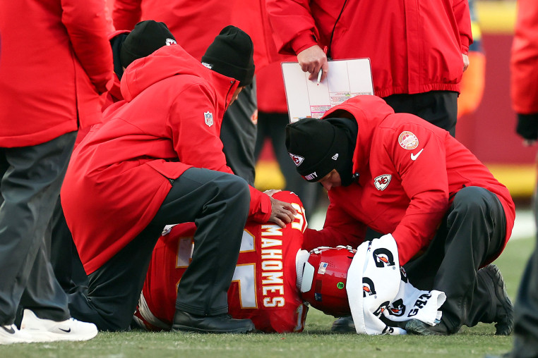 Image: Patrick Mahomes of the Kansas City Chiefs lays on the ground after sustaining an injury