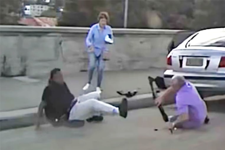 A couple wrestle with one of the Bondi Beach gunmen during the attack on Sunday, Dec. 16, 2025. 