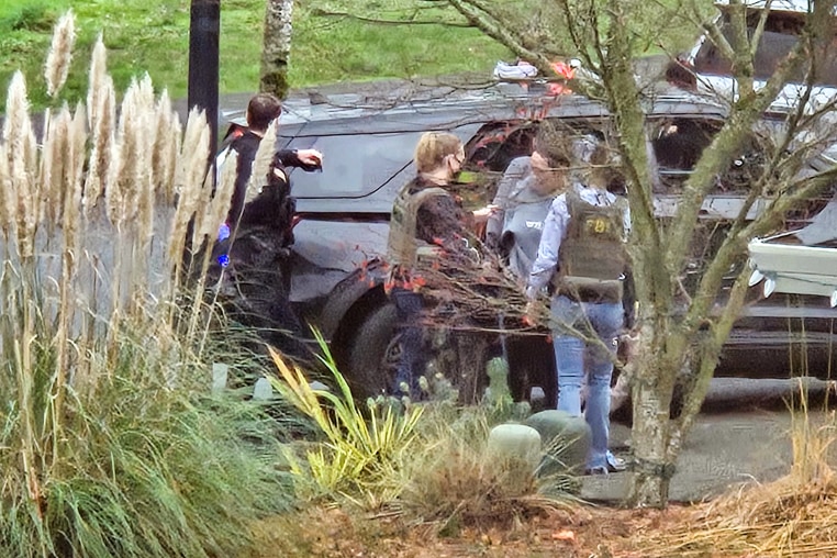 Law enforcement activity outside Megan Hall-Greenberg’s home in Washougal, Wash.