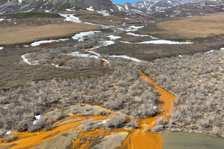 An orange tributary of the Kugororuk River in the Brooks Range of northern Alaska.