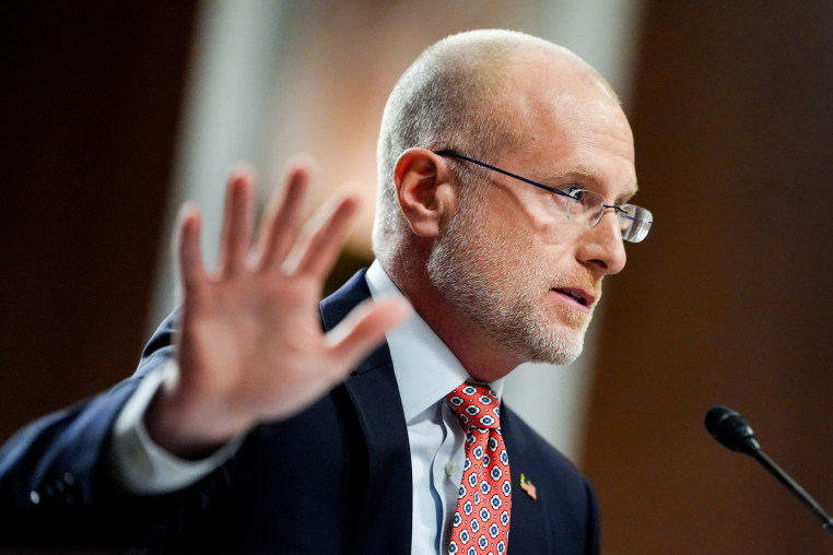 Brendan Carr raises his hand and speaks