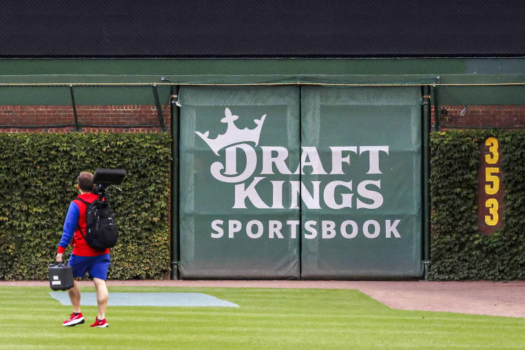A DraftKings Sportsbook logo is posted on the right field wall.