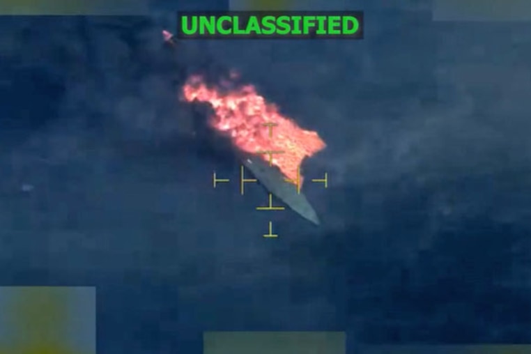 A vessel burns in the Eastern Pacific after it was hit by a U.S. strike on Dec. 12, 2025.