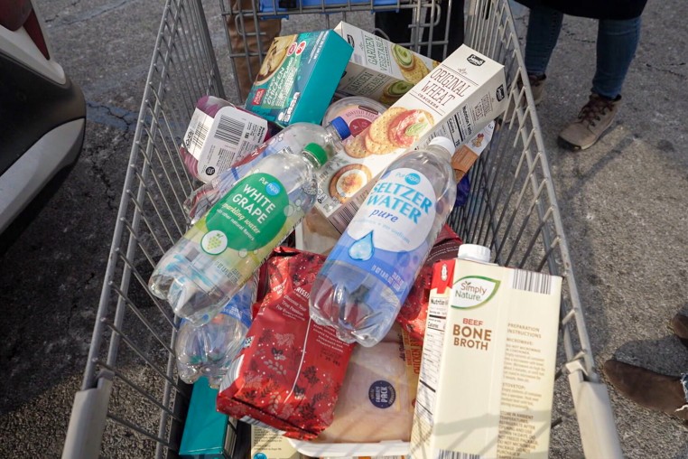 Brittany Zwier and Frank Martinez's grocery cart at Aldi, which does not provide traditional shopping bags.