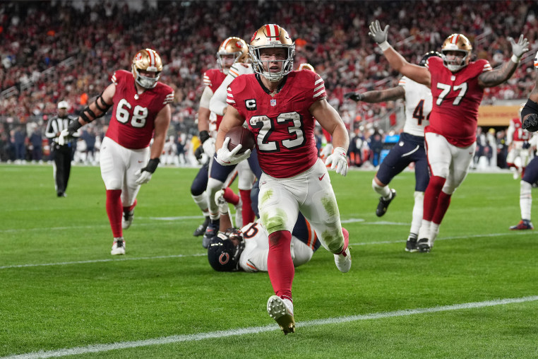 Christian McCaffrey #23 of the San Francisco 49ers runs for a touchdown against the Chicago Bears during the second quarter of the game at Levi's Stadium on December 28, 2025 in Santa Clara, California.