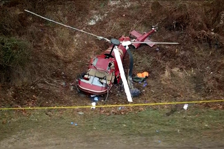A crashed helicopter on grass