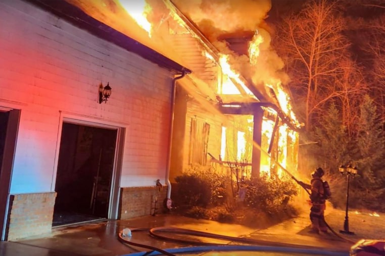 Firefighters battle a blaze at the home of Denny Hamlin’s father following a fatal house fire.