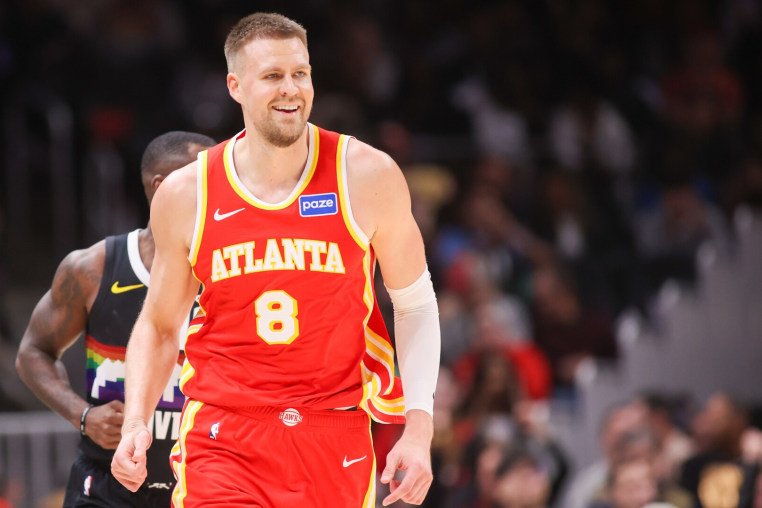 Dec 5, 2025; Atlanta, Georgia, USA; Atlanta Hawks center Kristaps Porzingis (8) reacts after a basket against the Denver Nuggets in the third quarter at State Farm Arena. Mandatory Credit: Brett Davis-Imagn Images
