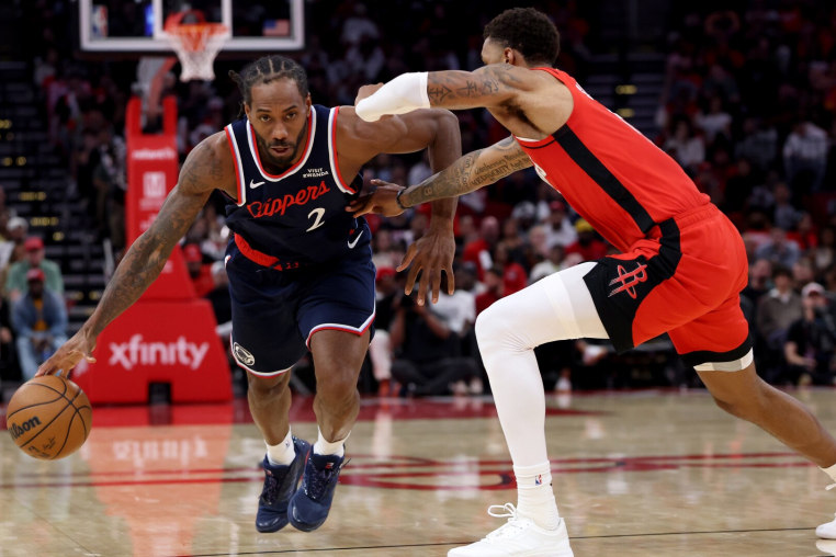 HOUSTON, TEXAS - DECEMBER 11: Kawhi Leonard #2 of the LA Clippers drives to the basket against Jabari Smith Jr. #10 of the Houston Rockets in the second half at Toyota Center on December 11, 2025 in Houston, Texas.   NOTE TO USER: User expressly acknowledges and agrees that, by downloading and or using this photograph, User is consenting to the terms and conditions of the Getty Images License Agreement. (Photo by Tim Warner/Getty Images)