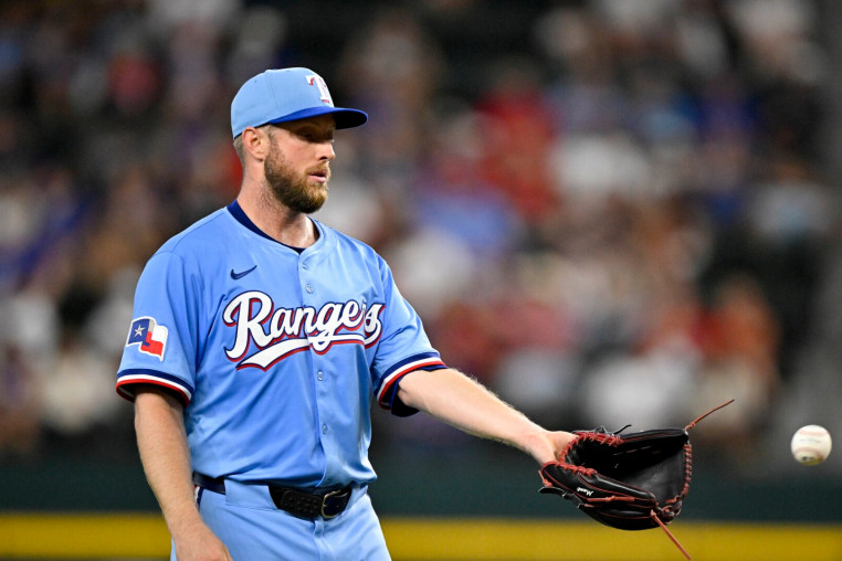 Sep 21, 2025; Arlington, Texas, USA; Texas Rangers starting pitcher Merrill Kelly (23) pitches against the Miami Marlins during the third inning at Globe Life Field. Mandatory Credit: Jerome Miron-Imagn Images