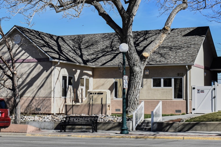 The exterior of Wellspring Health Access, a beige building