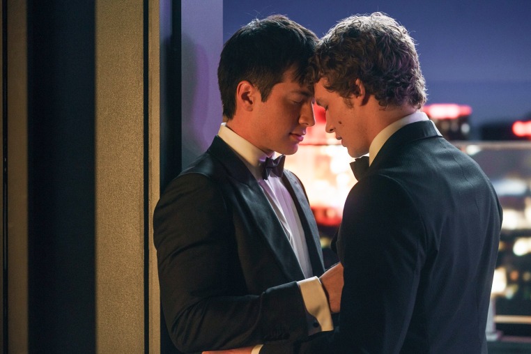 Hudson Williams, left, and Connor Storrie embrace outside