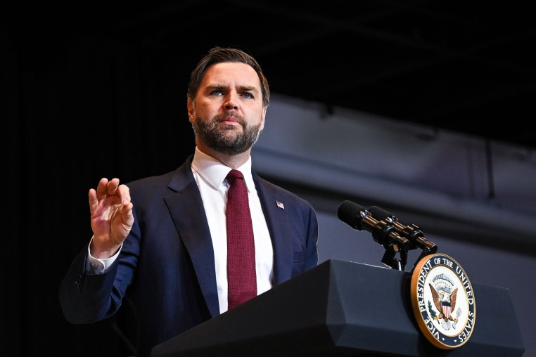 JD Vance speaks at a podium