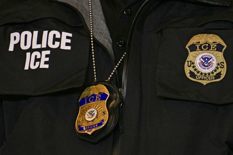 An ICE patch and badge on an officer in Minneapolis.