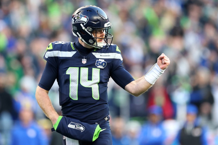 Seattle Seahawks quarterback Sam Darnold celebrates a first quarter touchdown against the Los Angeles Rams in the NFC Championship game. 