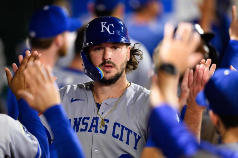 Sep 25, 2025; Anaheim, California, USA; Kansas City Royals designated hitter Vinnie Pasquantino (9) is greeted by teammates after scoring during the ninth inning against the Los Angeles Angels at Angel Stadium. Mandatory Credit: William Liang-Imagn Images