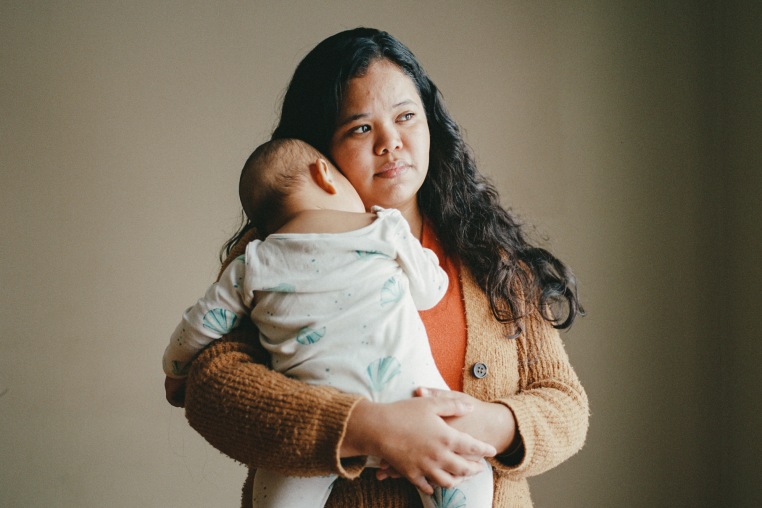 Maria Ibarra holds her baby
