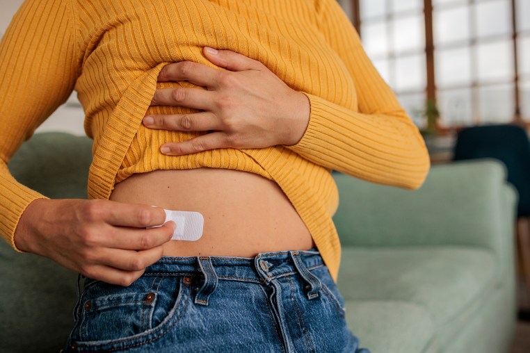 Female Applying HRT Patch for Hormonal Balance