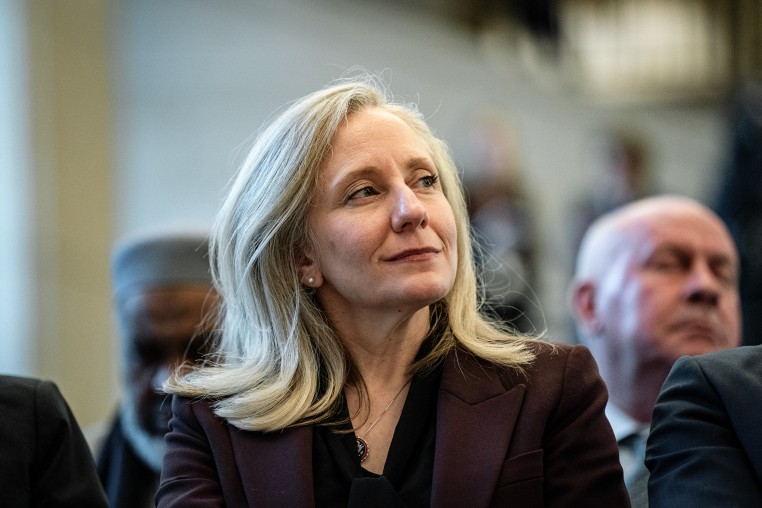 Abigail Spanberger smiles as she looks over her left shoulder.