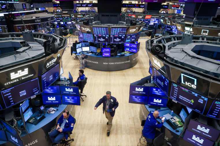 Traders At The New York Stock Exchange as stocks climb on factory data as gold selloff eases