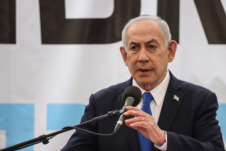 Israel's Prime Minister Benjamin Netanyahu delivers a speech during the funeral of Israeli hostage Ran Gvili.