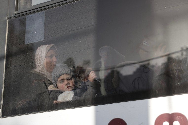War-wounded Palestinians and other patients sit in a coach as they prepare to leave the Gaza Strip for treatment through the Rafah border crossing between the Gaza Strip and Egypt on February 8.