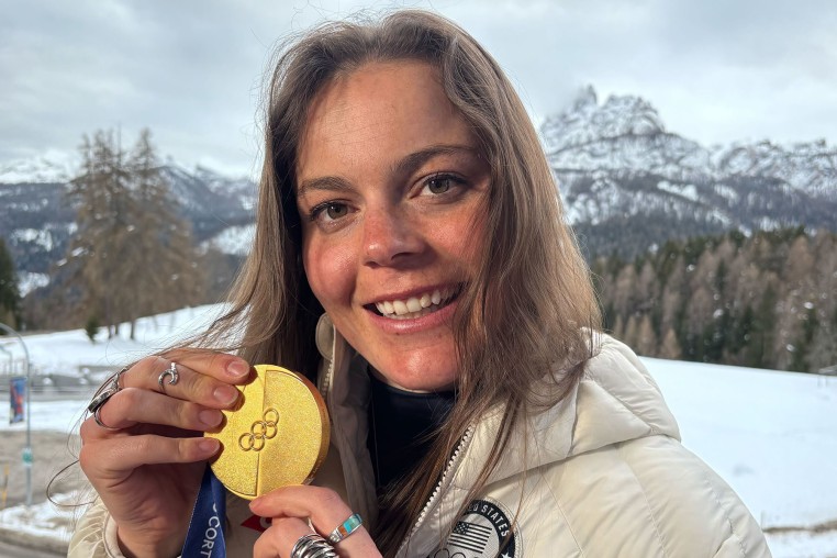 Breezy Johnson poses with her gold medal.