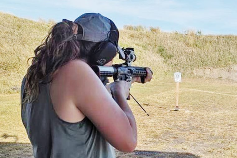 A woman takes aim at the "Grassroots Defense" firing range in Iowa.