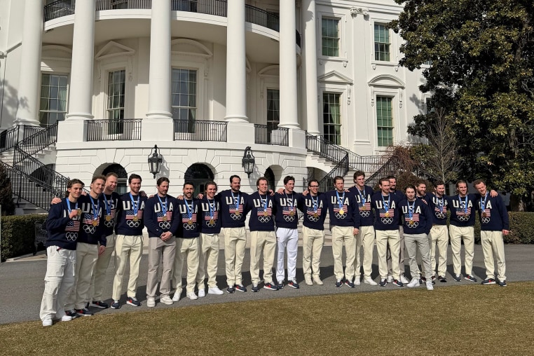 The U.S. men's hockey team poses with their gold medals at the White House on Feb. 24, 2026.