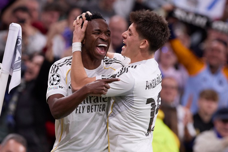 Vinicius Junior (L) of Real Madrid CF and Arda Guler (R) of