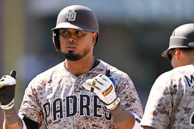 Aug 10, 2025; San Diego, California, USA; San Diego Padres first baseman Luis Arraez (4) gestures after hitting a single during the seventh inning against the Boston Red Sox at Petco Park. Mandatory Credit: Denis Poroy-Imagn Images