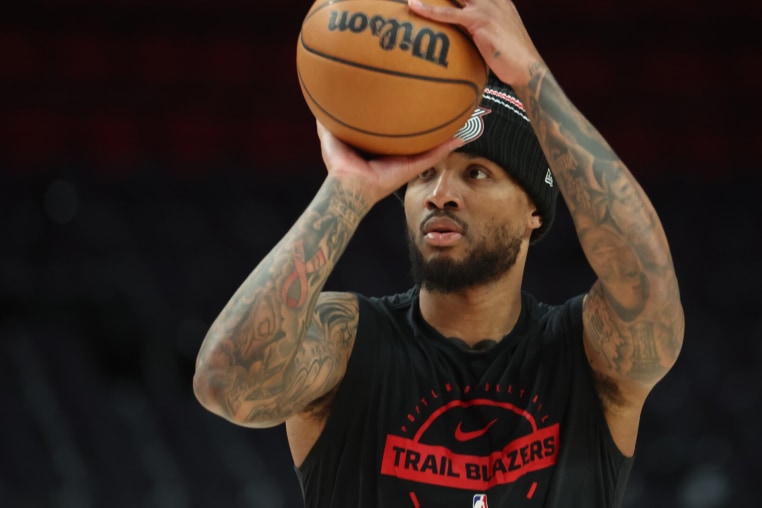 Feb 9, 2026; Portland, Oregon, USA; Portland Trail Blazers guard Damian Lillard (0) shoots a three-point shot during warm ups before the Trail Blazers play against the Philadelphia 76ers at Moda Center. Mandatory Credit: Jaime Valdez-Imagn Images