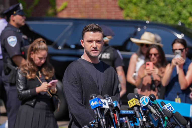 Justin Timberlake gives a statement to several media channels.