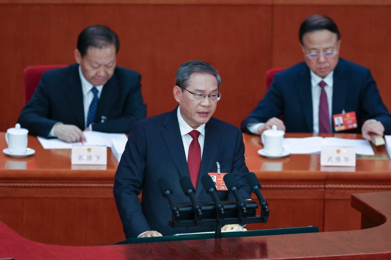 Chinese Premier Li Qiang delivers a work report during the opening session of the National People's Congress (NPC)  at the Great Hall of the People in Beijing.