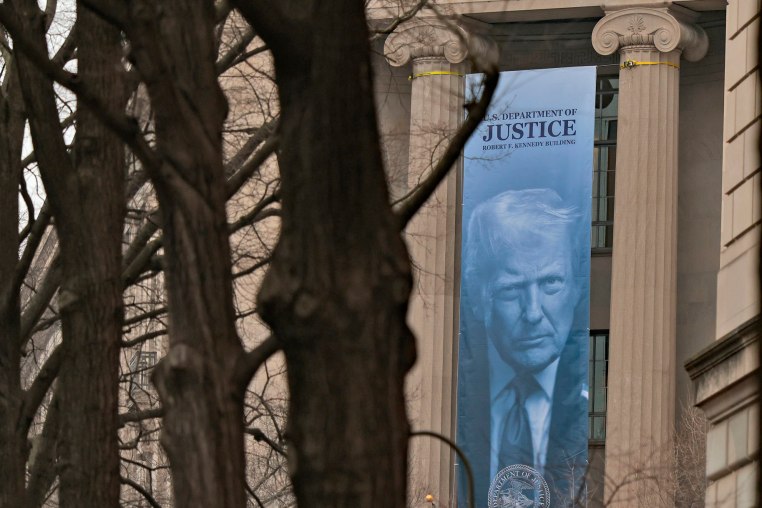 A banner featuring President Donald hangs at the Department of Justice on Feb. 19, 2026.