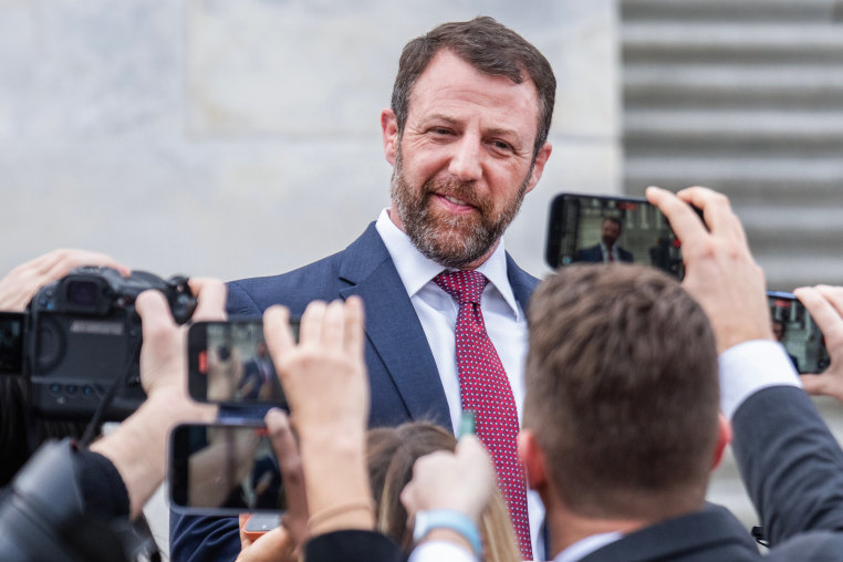 Sen. Markwayne Mullin, R-Okla., talks with reporters outside the U.S. Capitol