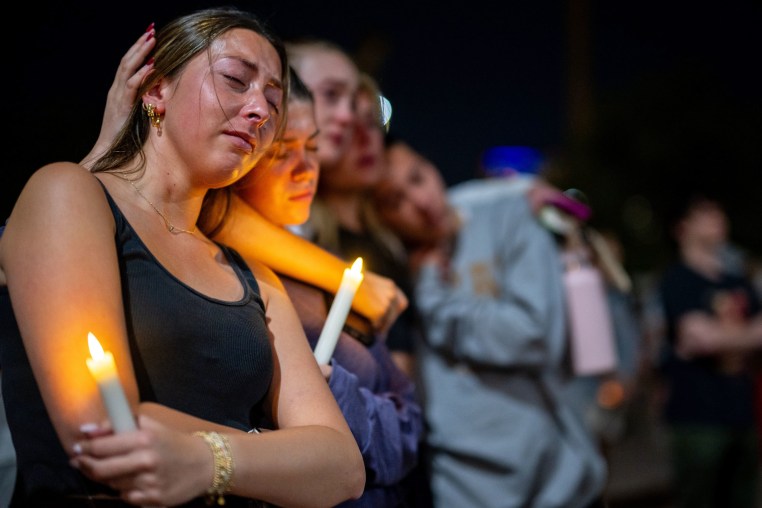 Students gather for a candlelight vigil for the victims of Sunday's mass shooting, at the University of Texas at Austin on March 4, 2026.