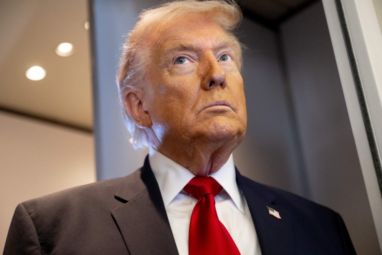 Donald Trump gazes off camera while aboard Air Force One.