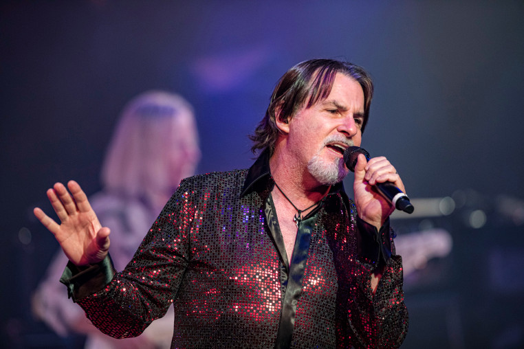 Tommy DeCarlo sings on stage