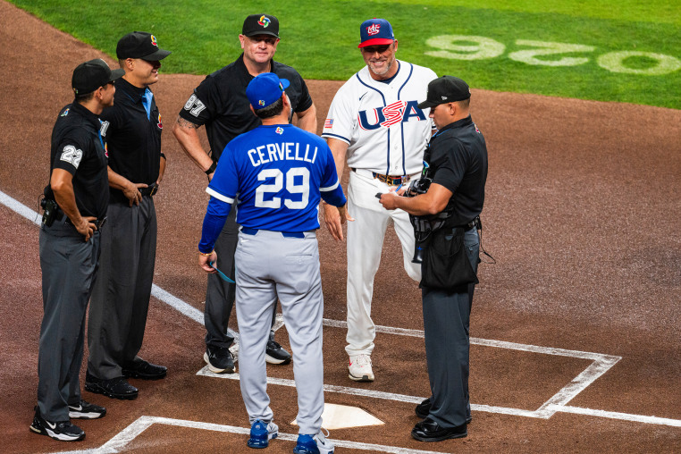 Manager Mark DeRosa of Team United States shakes hands before the game with manager Francisco Cervelli #29 of Team Italy before a game