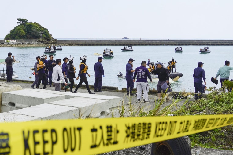 Image: Japanese Coast Guard officers prepare to search for capsized boats